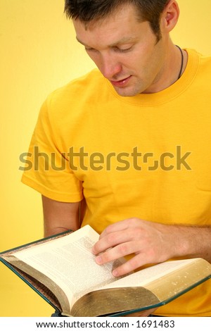Attractive 26 year old man reading book.
