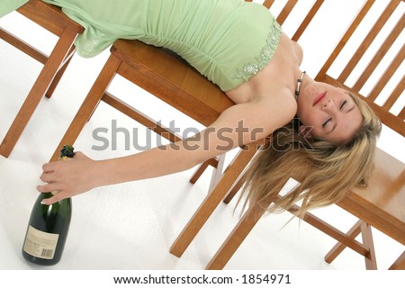 stock photo Prom teen passed out with empty bottle of champagne
