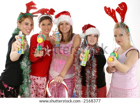 Diverse group of five teens having a Christmas Slumber Party.  Aiming silly string and water guns at camera over white background,