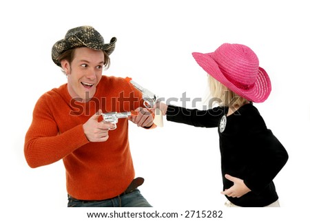 Father and five year old daughter wearing cowboy hats and laughing