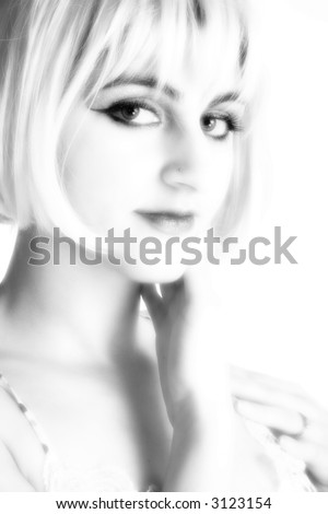 Portrait of beautiful Middle Eastern woman in black and white with blonde hair.