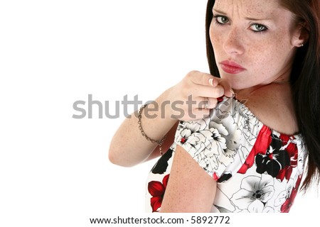 Beautiful Seventeen year old girl making facial expressions over white.  Angry pointing.