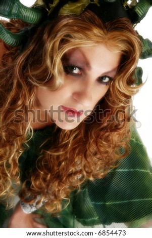 Beautiful 30 year old woman with long curly hair and artistic make-up.