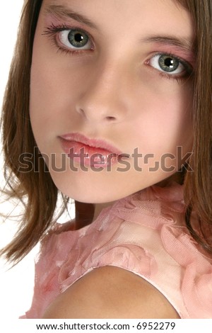 Beautiful 12 year old girl in make-up and formal dress. Headshot