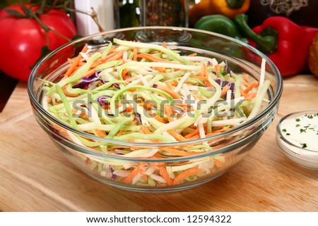 Bowl of organic sprout salad in kitchen or restaurant.  Carrots, cabbage, sprout,