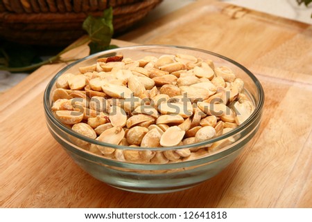 Unsalted dry roasted peanuts in a bowl in kitchen or restaurant.