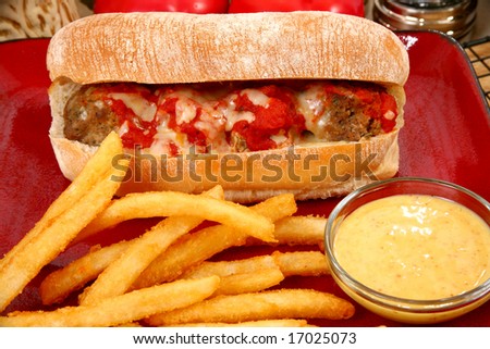 Italian meatball sandwich, spicy fries and honey mustard sauce.
