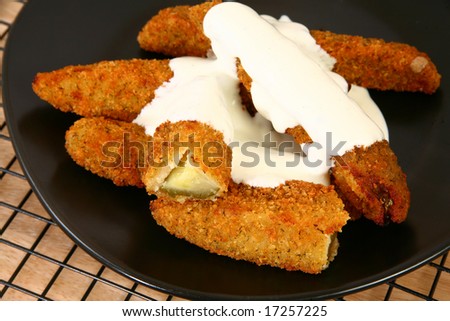 Plate of fried pickles and ranch dressing.