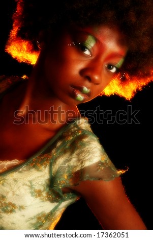 Beautiful african american woman in artistic cosmetics.
