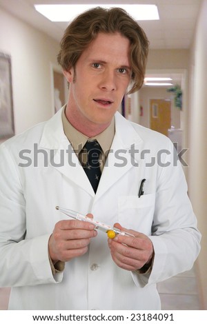Man in white lab coat with thermometer  in clinic hallway.