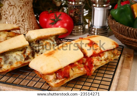 Toasted submarine sandwich with chicken, melted mazerella cheese, and marinara sauce.