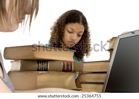 Copyright on books has expired....  Study Session. Teen girls at table with old law books.
