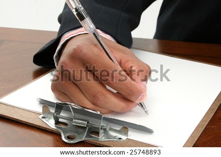 Black African American hand in business suit signing document paper contract with ink pen.