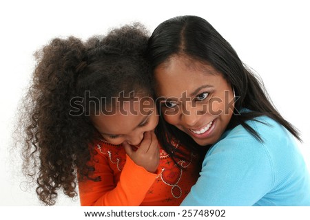 Attractive African American mother and daughter hugging.