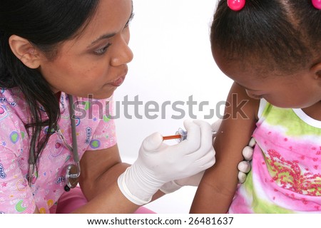 Nurse giving young girl a shot in the arm.
