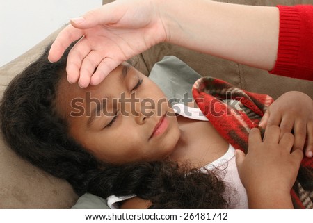 Adorable five year old African American Girl in bed sick.