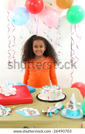 Adorable 8 year old African American girl at birthday party.