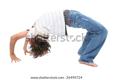 stock photo Teen boy doing back bend over white