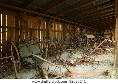 American 1800 farm tools rusting in shack.