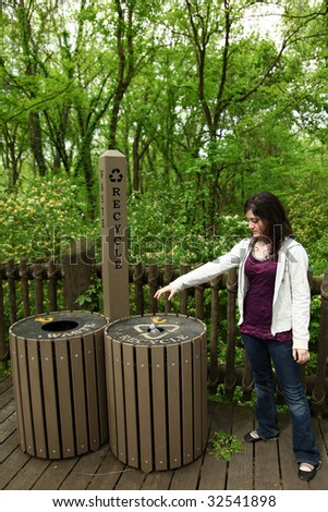 Teen girl using recycle and waste cans at park.