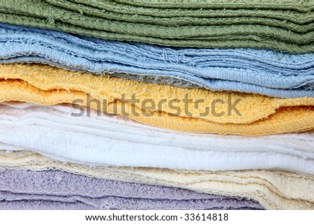 Close up of stack of colorful wash cloths.