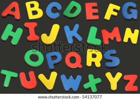 Colorful alphabet letters in order on a chalkboard