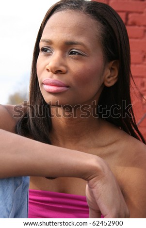 Beautiful 25 year old african american woman casual portrait outdoors.