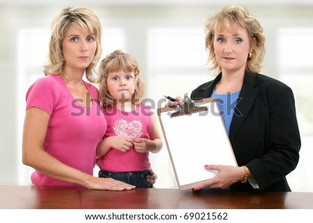 Parent teacher conference meeting at school with unhappy mom, child and teacher.  Teacher holding blank paper towards camera.