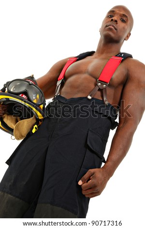 Attractive black thirty something male firefighter in uniform over white background.
