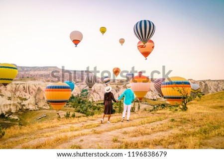 Turkey balloons Cappadocia Goreme Kapadokya , Sunrise in the mountains of Capadocia, young couple sunrise