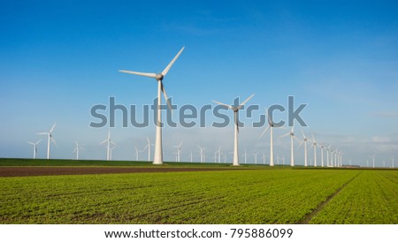 Offshore Windmill farm in the ocean  Westermeerwind park , windmills isolated at sea on a beautiful bright day Netherlands Flevoland Noordoostpolder