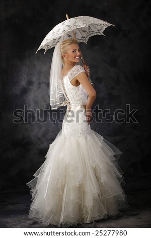 stock photo beautiful woman in wedding dress holding umbrella