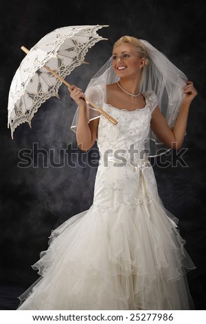 stock photo beautiful woman in wedding dress holding umbrella