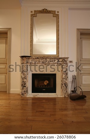 large mirror on marble fireplace