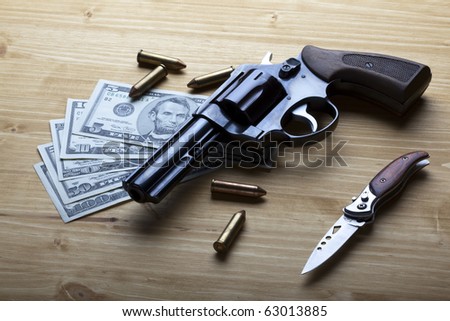Money, gun and knife