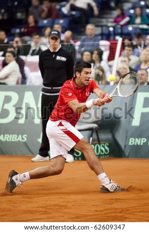 BELGRADE, SERBIA - MARCH 7: Novak Djokovic plays against John Isner in the Davis Cup 2010 on March 7, 2010 in Belgrade, Serbia.