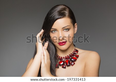 Nice, sensual woman face with make up and red lips
