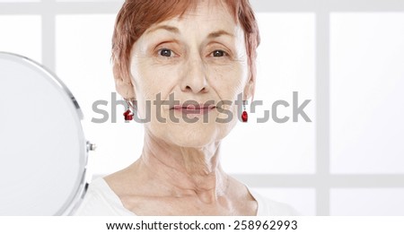 Sixty years old woman and tender