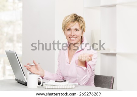 Forty years woman at work\
with positive attitude