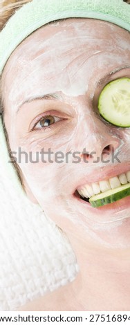 Forty years woman\
with face mask and cucumber