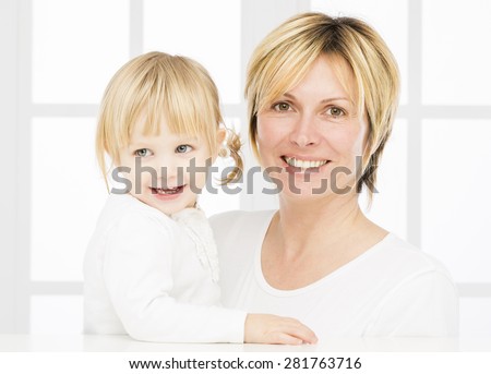 Forty years old mother\
with her two years old baby girl