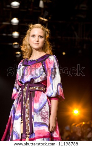 good-looking female model at a fashion show(Russian Fashion Week) 08