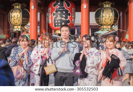 TOKYO,JAPAN - January 25, 2015  :Unidentified tourists in the Senso-ji Temple in Tokyo,Japan.The Senso-ji Buddhist Temple is the symbol of Asakusa and one of the most famed temples in all of Japan