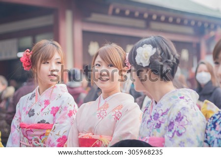 Tokyo, Asakusa. January 25, 2015. girls in japanese typical dress. The kimono is the traditional japanese dress and means literally \