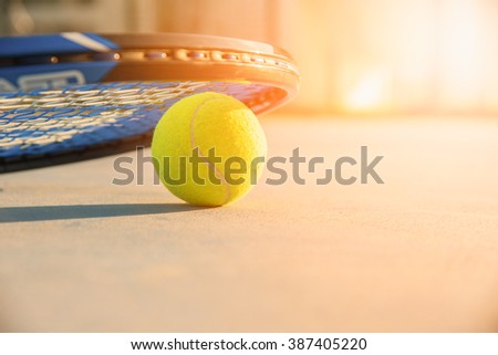 Tennis Ball and Racket. green color tennis ball. single tennis ball. tennis ball from Thailand. tennis ball vivid tone. the new tennis ball. beautiful tennis ball. Tennis ball on a tennis court