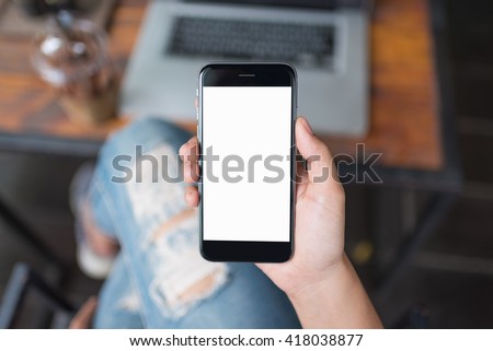 girl using smartphone in cafe. using iphon on wood table. woman using smartphone white screen.