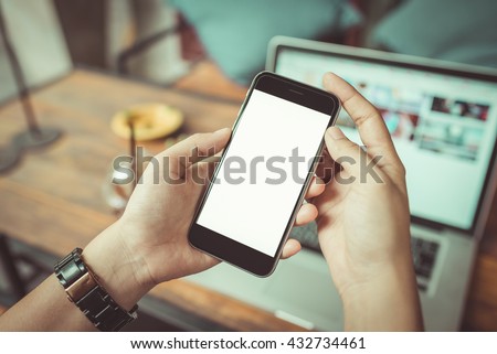 girl using smartphone in cafe. using iphon on wood table. woman using smartphone white screen. vintage tone.
