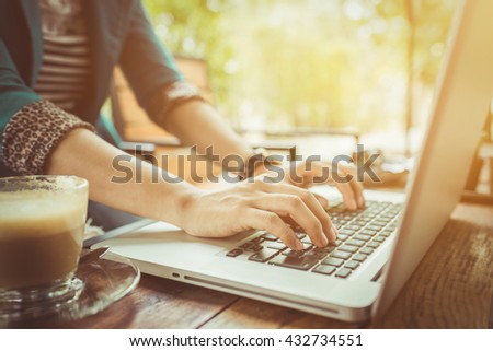 Female working on laptop in a cafe. woman using laptop in home. using laptop internet. using laptop job. beautiful girl using laptop. girl using laptop from thailand. hand using laptop in coffe shop