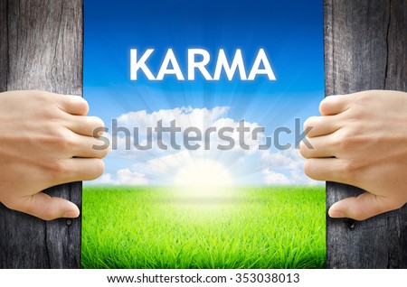 KARMA. Hand opening an old wooden door and found wording \