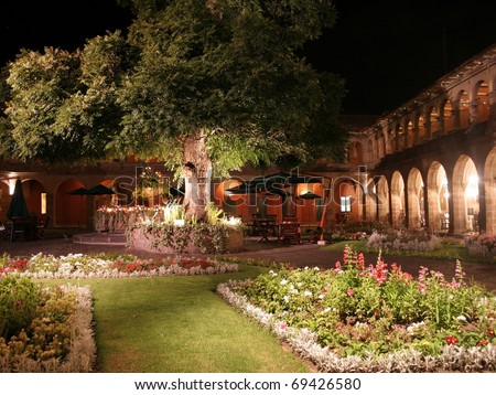 Garden Courtyard of a luxury boutique hotel at night, in Cuzco City, South America